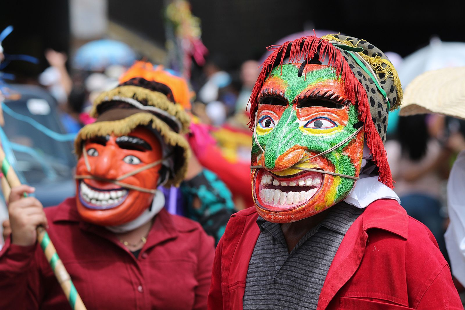 Festival parade with painted masks in San Salvador